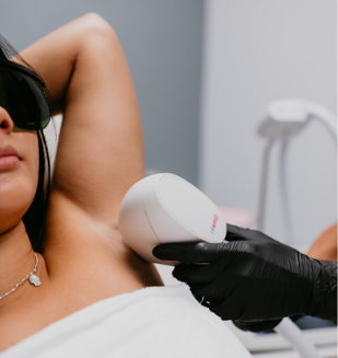Blonde woman having underarm Laser hair removal epilation. Laser treatment in cosmetic salon | White Coat Aesthetics in Las Vegas, NV