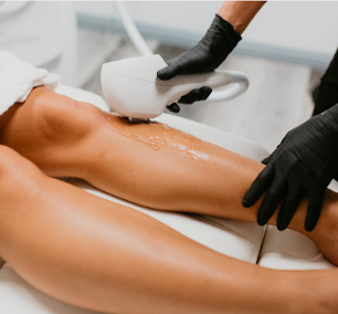 Blonde woman having leg Laser hair removal epilation Laser treatment in cosmetic salon | White Coat Aesthetics in Las Vegas, NV