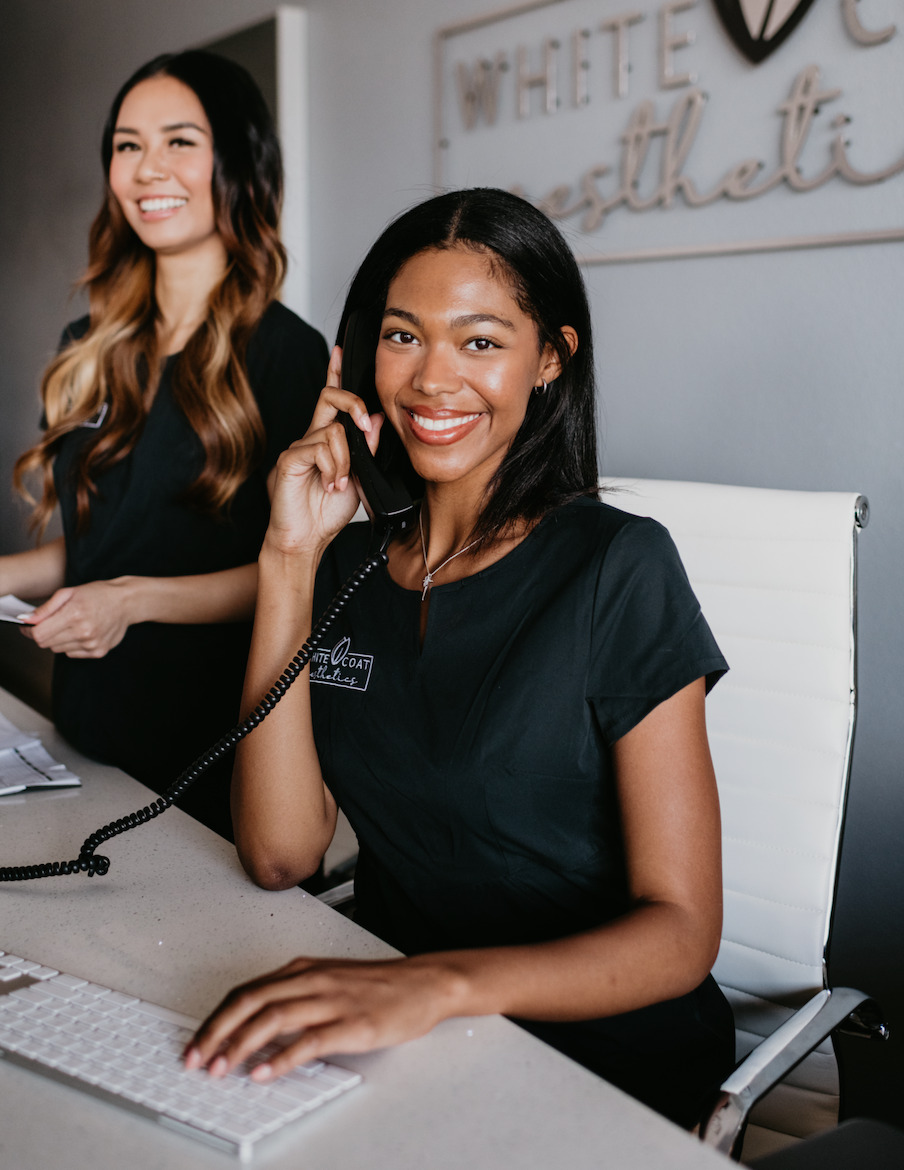 Young Receptionist Smiling Photo | White Coat Aesthetics in Las Vegas, NV