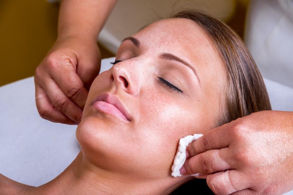 Woman getting ready for cosmetic injection of botox holding syringe and rubbing with cotton by Cosmetologist. | White Coat Aesthetics in Las Vegas, NV