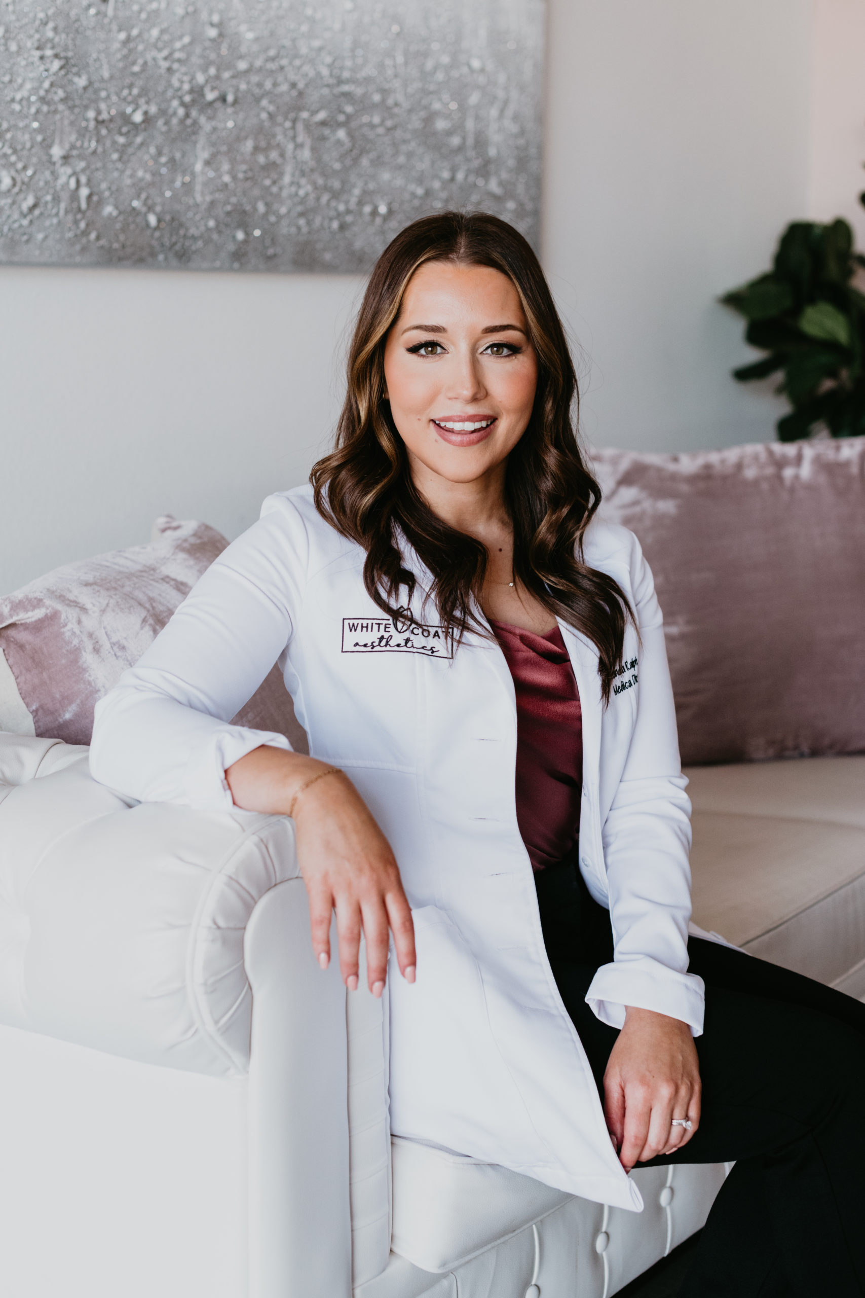 Amanda Ralph sitting on couch | White Coat Aesthetics in Las Vegas, NV